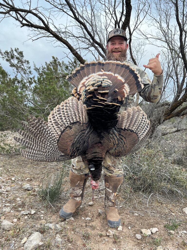 Hunter holding turkey